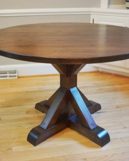 This ash trestle table was finished with a dark wood stain and a waterproof clear coat.